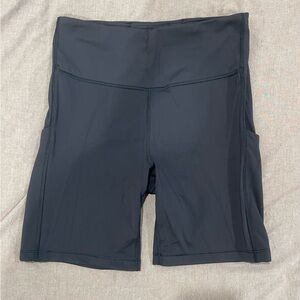 7” Black Athleta Ultimate Stash Biker Shorts